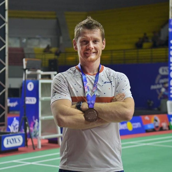 This image features New Zealand athlete, Wojtek Czyz with his bronze medal.